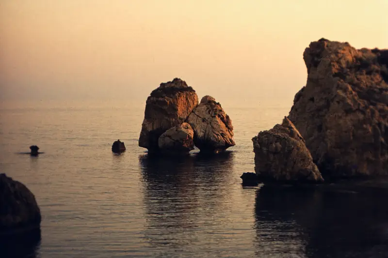 The sea stacks of Petra tou Romiou in golden evening light