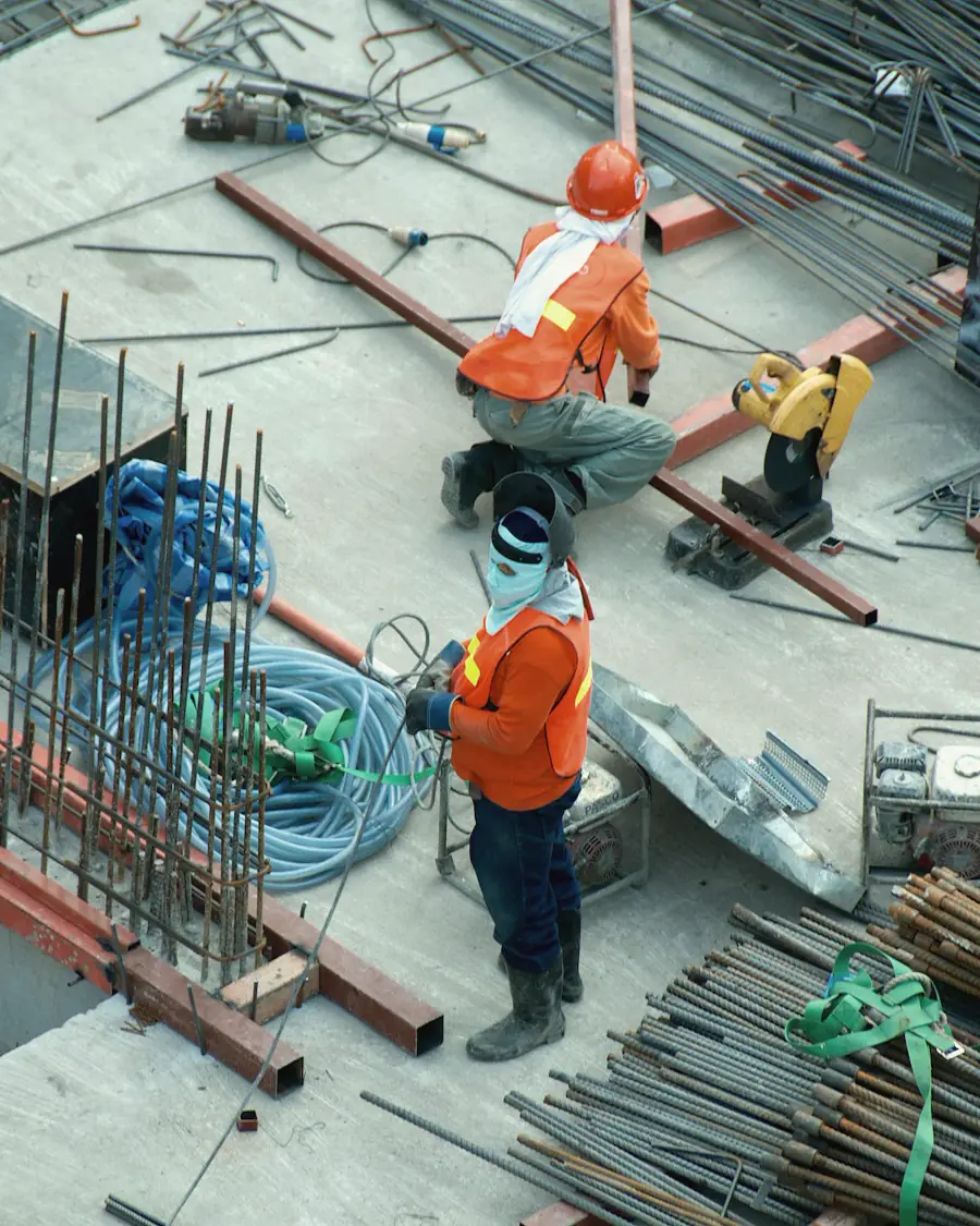 Site crew fixing reinforcement on a concrete slab