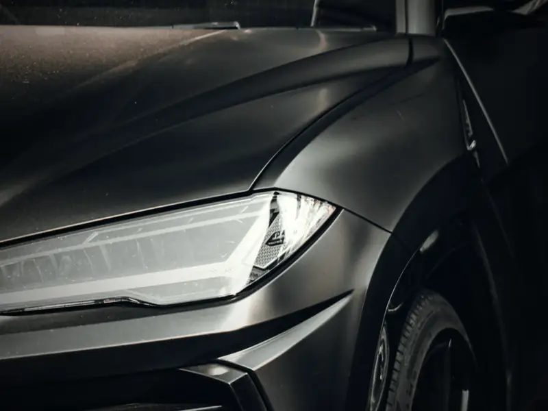 Close-up of a black Lamborghini Urus headlight